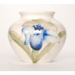 William Moorcroft - A small salt glazed vase decorated in the Frilled Orchid pattern with tonal