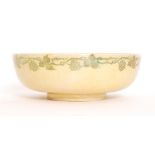 Ashby Guild - An early 20th Century footed bowl decorated in a yellow lustre with a stencilled