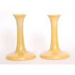 Ruskin Pottery - A pair of yellow lustre candlesticks, impressed marks, dated 1924, height 17.