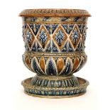 Frank Butler - Doulton Lambeth - A stoneware jardiniere of footed cylindrical form with a matching