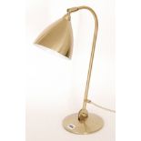 Gubi - A 'Bestlite' adjustable desk lamp in a bronze effect finish.