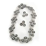 Birgur Haglund - A 1930s Swedish silver necklace designed as a series of ten groups of four concave