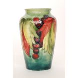 William Moorcroft - A Leaf and Berry pattern vase of high shouldered form decorated with tubelined