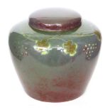 Ruskin Pottery - A souffle glaze vase and cover of high shouldered form with a flat cover,