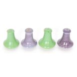 Ruskin Pottery - Four similarly shaped pepper pots comprising two glazed in a lavender lustre and