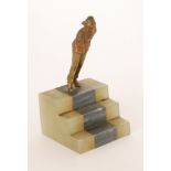 In the manner of Josef Lorenzl - A small 1930s Art Deco bronze figure of a lady in a trouser suit
