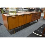Unknown, probably British - A teak 'Long Tom' style sideboard,