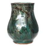 Della Robbia - A small early 20th Century vase decorated with incised stylised wrythen tulips,
