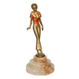 In the manner of Josef Lorenzl - A small 1930s Art Deco patinated bronze figure of a stylish lady