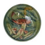William Moorcroft - A small footed bowl decorated with two tubelined fish,