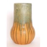 Ruskin Pottery - A crystalline glaze vase decorated in a dribbled blue glaze over orange,