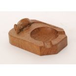 Robert 'Mouseman' Thompson - An oak ashtray of rectangular form with canted corners and with carved