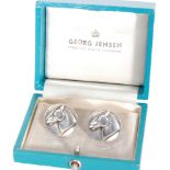 Georg Jensen - A pair of Danish Sterling silver cufflinks of circular outline decorated with a