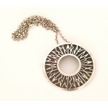 Shelia Fleet - A modern Scottish silver Runic pendant of circular outline decorated with Runic