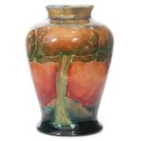 William Moorcroft - A small vase of inverted baluster form decorated in the Eventide pattern with