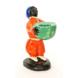 Clarice Cliff - Arab - A novelty candlestick modelled as a standing Arab in pantaloons with sash