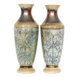 Robert Wallace Martin - Martin Brothers - A pair of late 19th Century vases of slender form with a