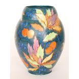 Carlton Ware - A large 1930s Art Deco Handcraft vase decorated in the Cherry pattern with leaves