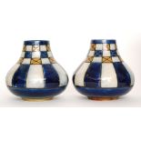 Royal Doulton - A pair of stoneware vases of low shouldered form with a tapered collar neck,