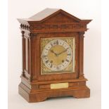 A late 19th Century architectural eight day strike mahogany mantle clock with Roman numerals to a