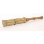 A late 19th Century four drawer brass telescope with lens cover,