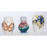 Three pieces of Moorcroft comprising a small ginger jar and cover decorated in the Butterfly