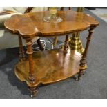 A Victorian walnut two tier occasional table of cartouche form,