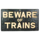 A cast iron sign 'Beware of Trains',