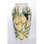 A Moorcroft Pottery vase decorated in the Finches on Lemons pattern designed by Sally Tuffin,