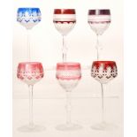 A harlequin set of later 20th Century crystal hock glasses of varying design with colour cased and