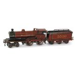 A Bassett Lowke 0 gauge 4-4-0 locomotive and tender No 5320 in maroon livery