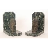 A pair of 1930s French Art Deco Egyptian revival book ends with a cast metal portrait head in head