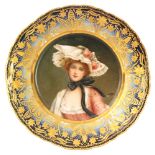 A 19th Century Vienna porcelain cabinet plate decorated to the centre with a hand painted portrait