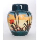 A boxed Moorcroft Pottery ginger jar and cover decorated the Reeds at Sunset pattern designed by