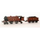 A Hornby O gauge 4-4-2 locomotive in brown livery and an associated Bing tender 2180,