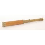 An early 20th Century three drawer brass telescope with sycamore end section engraved Hurter London,