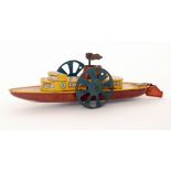 A Wells Brimtoy paddle steamer with single funnel, yellow and red lithographed deck,