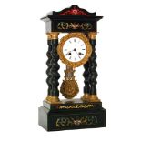 A late 19th Century ebonised portico mantle clock with circular white enamelled dial in spiral