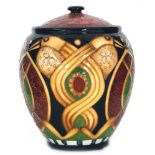 A boxed Moorcroft Pottery vase and cover decorated in the Staffordshire Gold pattern designed by