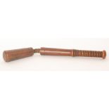 A 19th Century naval fruitwood cosh with ribbed handle and separate leather thong section,
