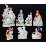 A collection of assorted 19th Century Staffordshire figures and flatbacks to include a figure of a