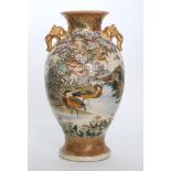 A late 19th to early 20th Century Japanese Satsuma vase with moulded elephant head handles,