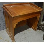 An early 20th Century mahogany and pine schoolmaster's desk,