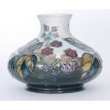 A Moorcroft Pottery vase of compressed form decorated in the Brambles pattern designed by Sally