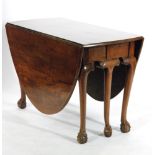An Edwardian mahogany oval dining table,
