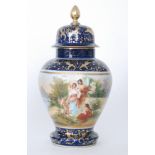 A large late 19th to early 20th Century Dresden Vienna type vase and cover decorated with a