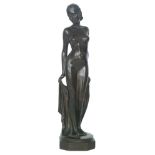 An Art Deco style bronze figure of a naked female figure holding a robe on an octagonal base,