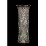 A large American Brilliant Period cut crystal glass vase if sleeve form with a scalloped rim,
