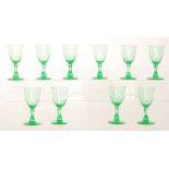 A set of ten late 19th Century Uranium green wine glasses with a slice cut bowl above a slice cut