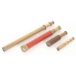 A red lacquered cased two drawer brass telescope, a single drawer brass telescope,